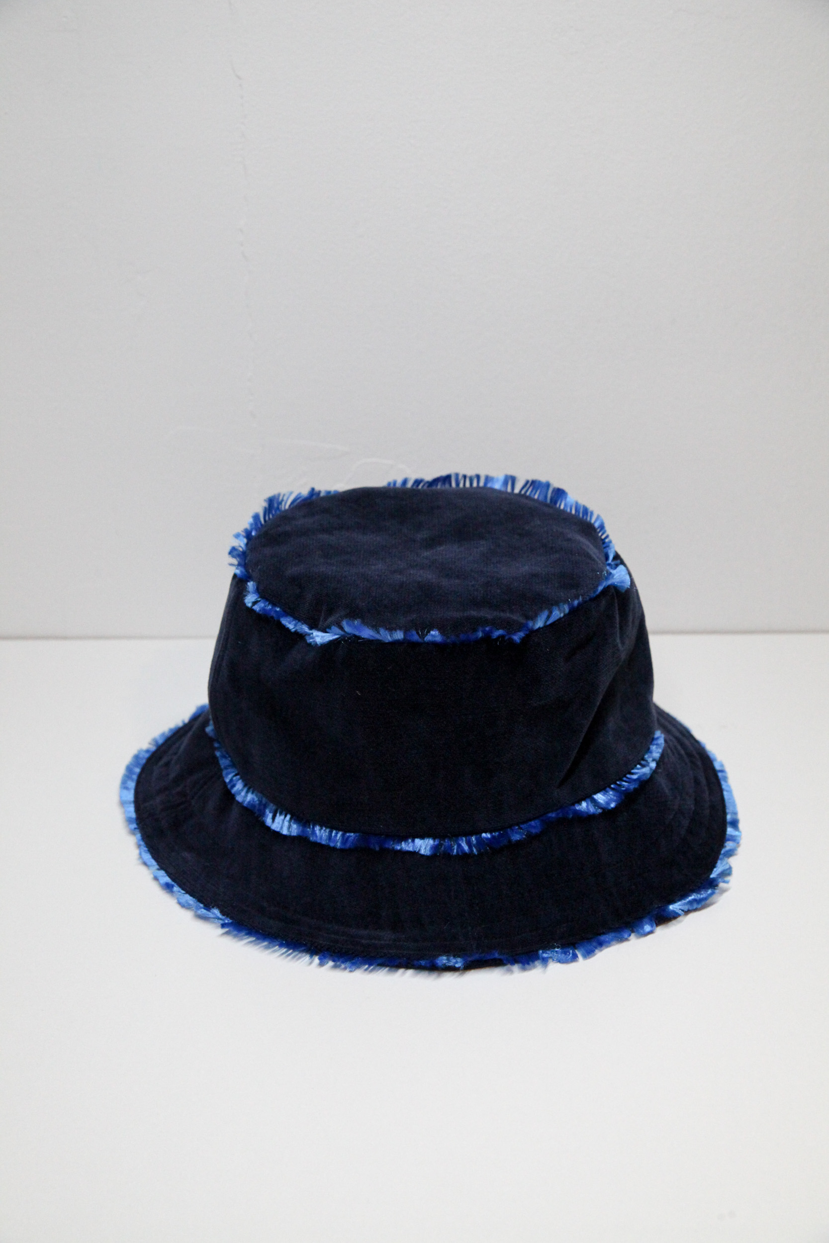 Velvet midnight blue bucket hat with flashy lining