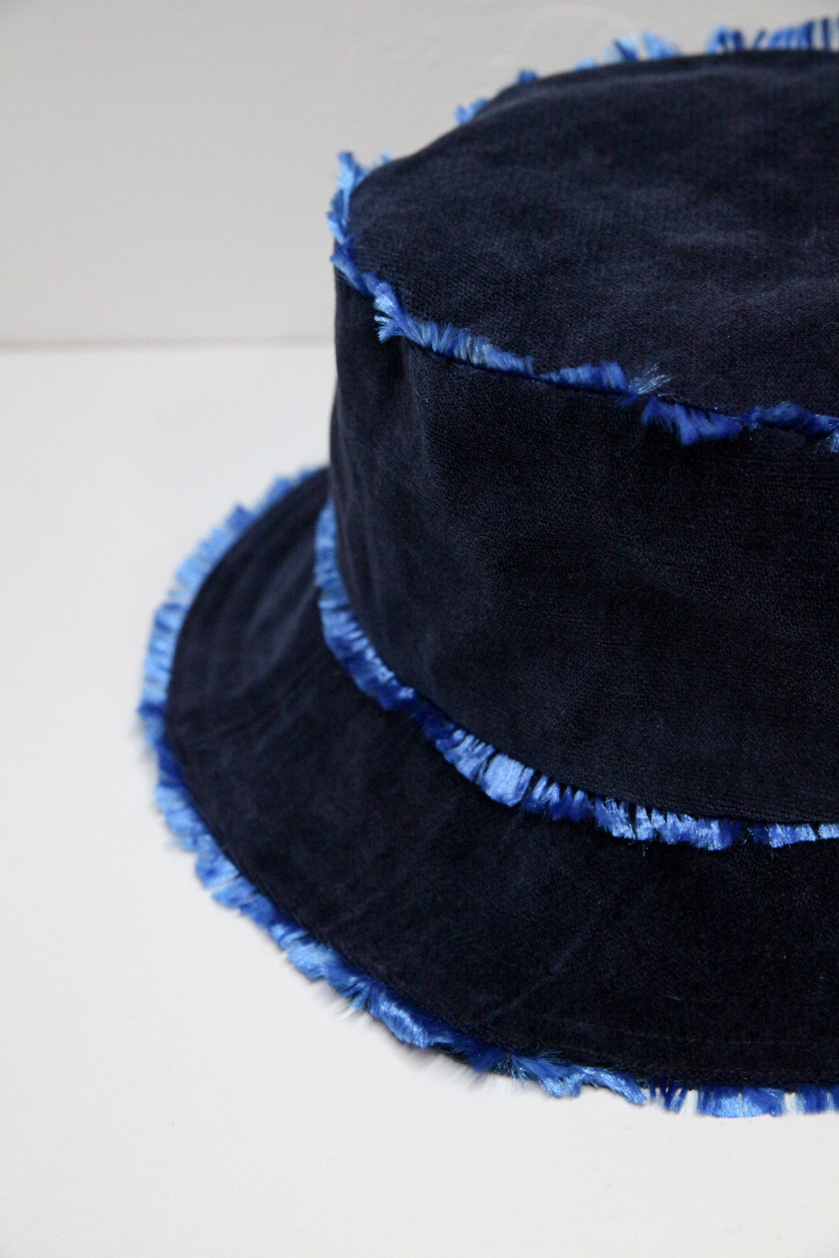 Velvet midnight blue bucket hat with flashy lining