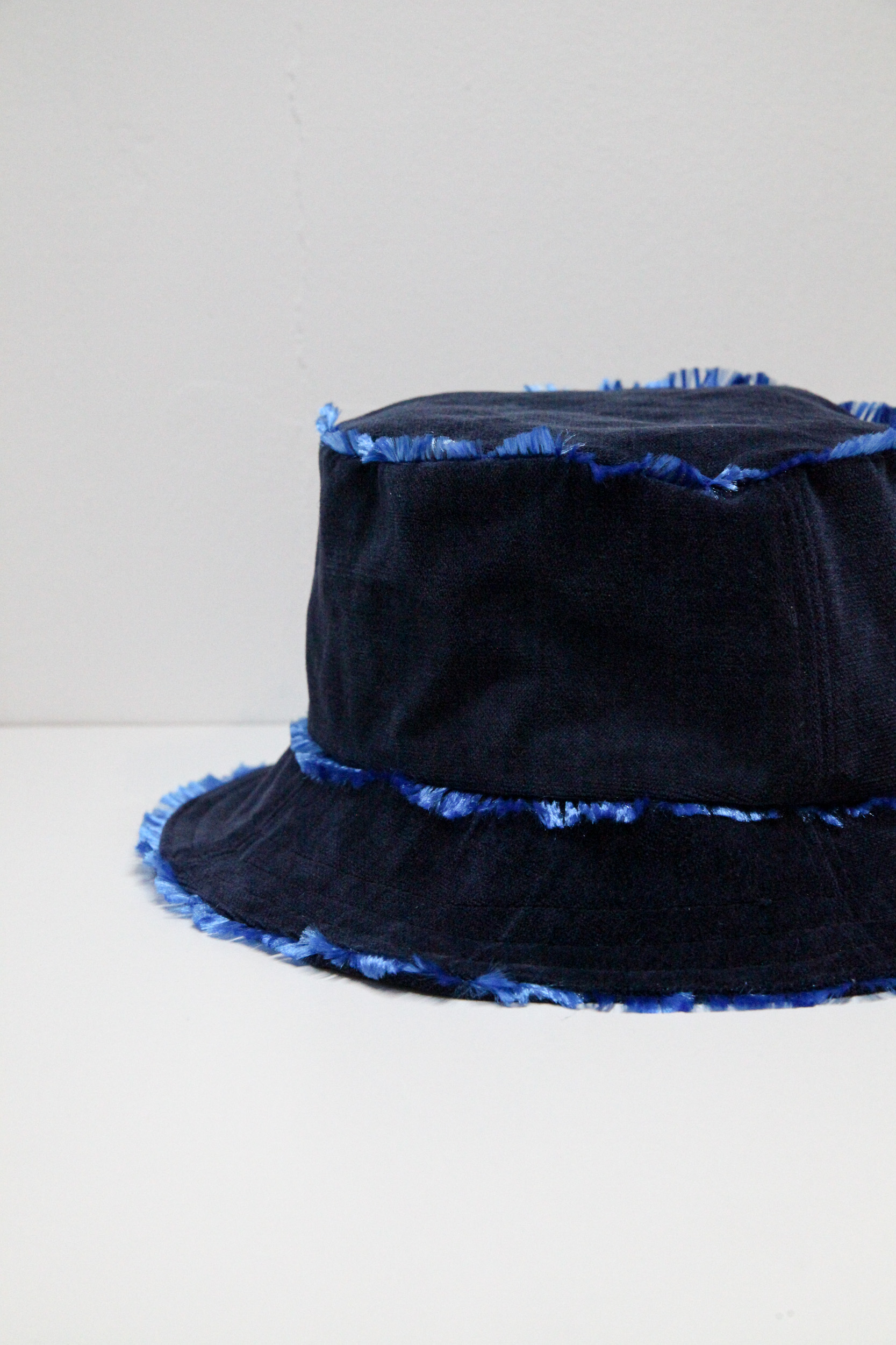 Velvet midnight blue bucket hat with flashy lining