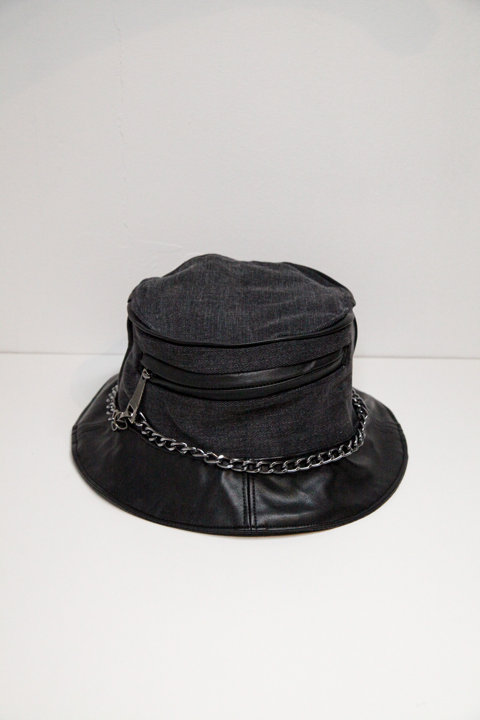 Black and grey bucket hat with chain and pocket on front