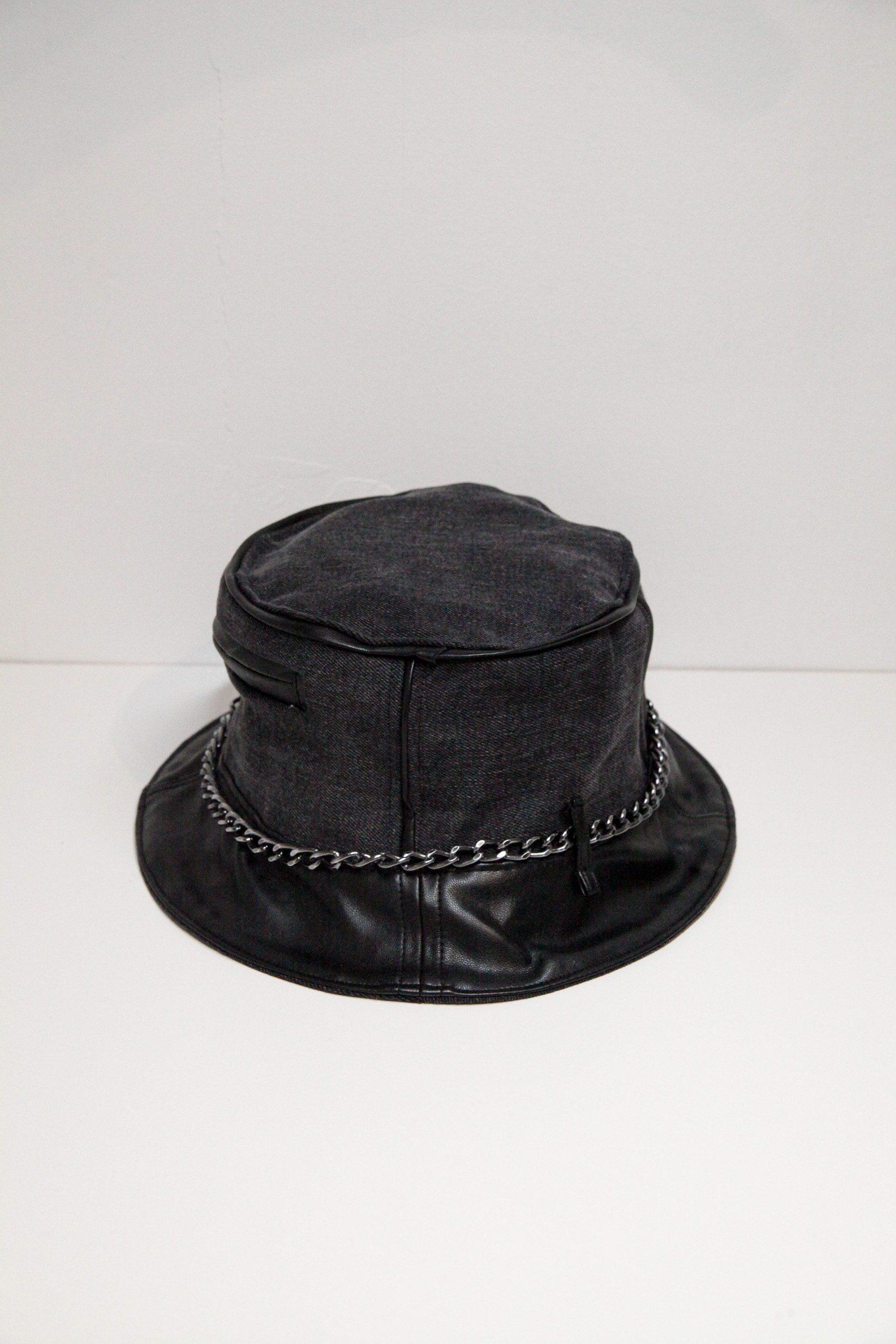 Black and grey bucket hat with chain and pocket on front