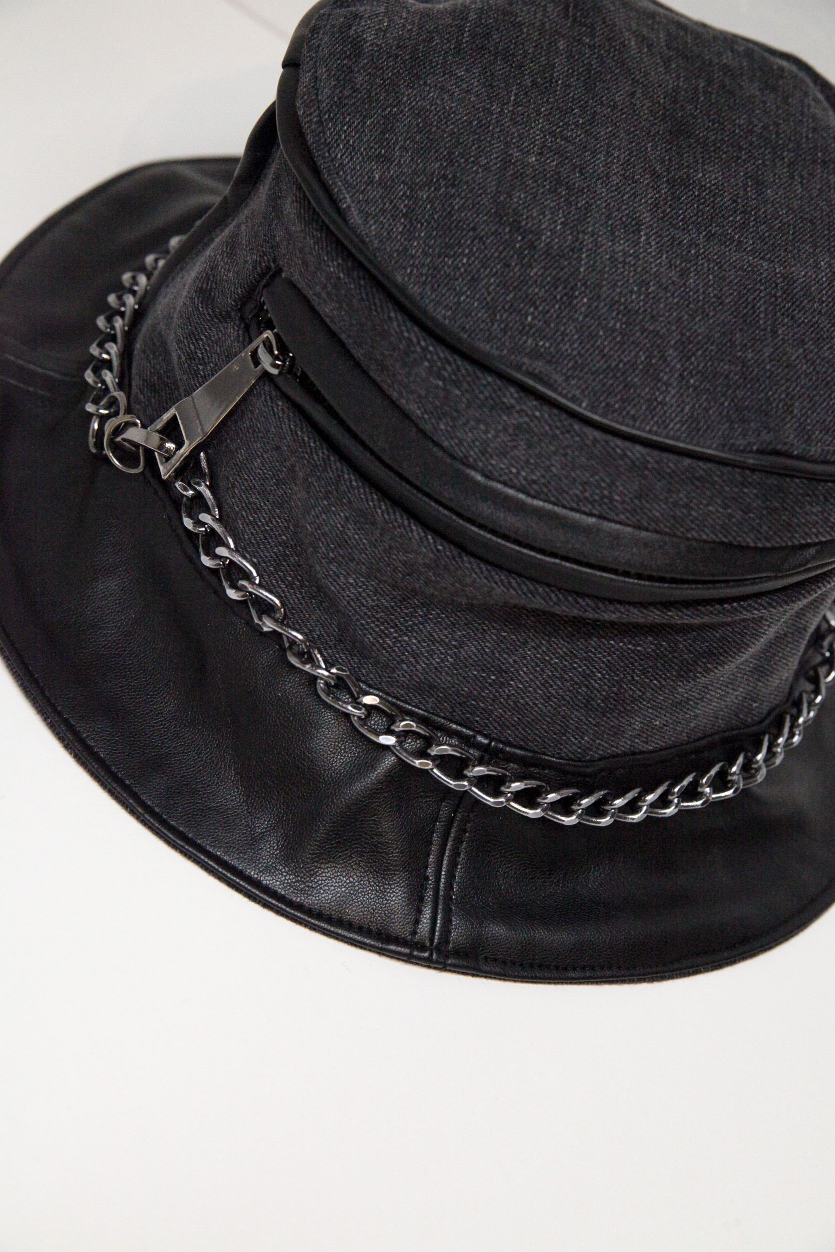 Black and grey bucket hat with chain and pocket on front