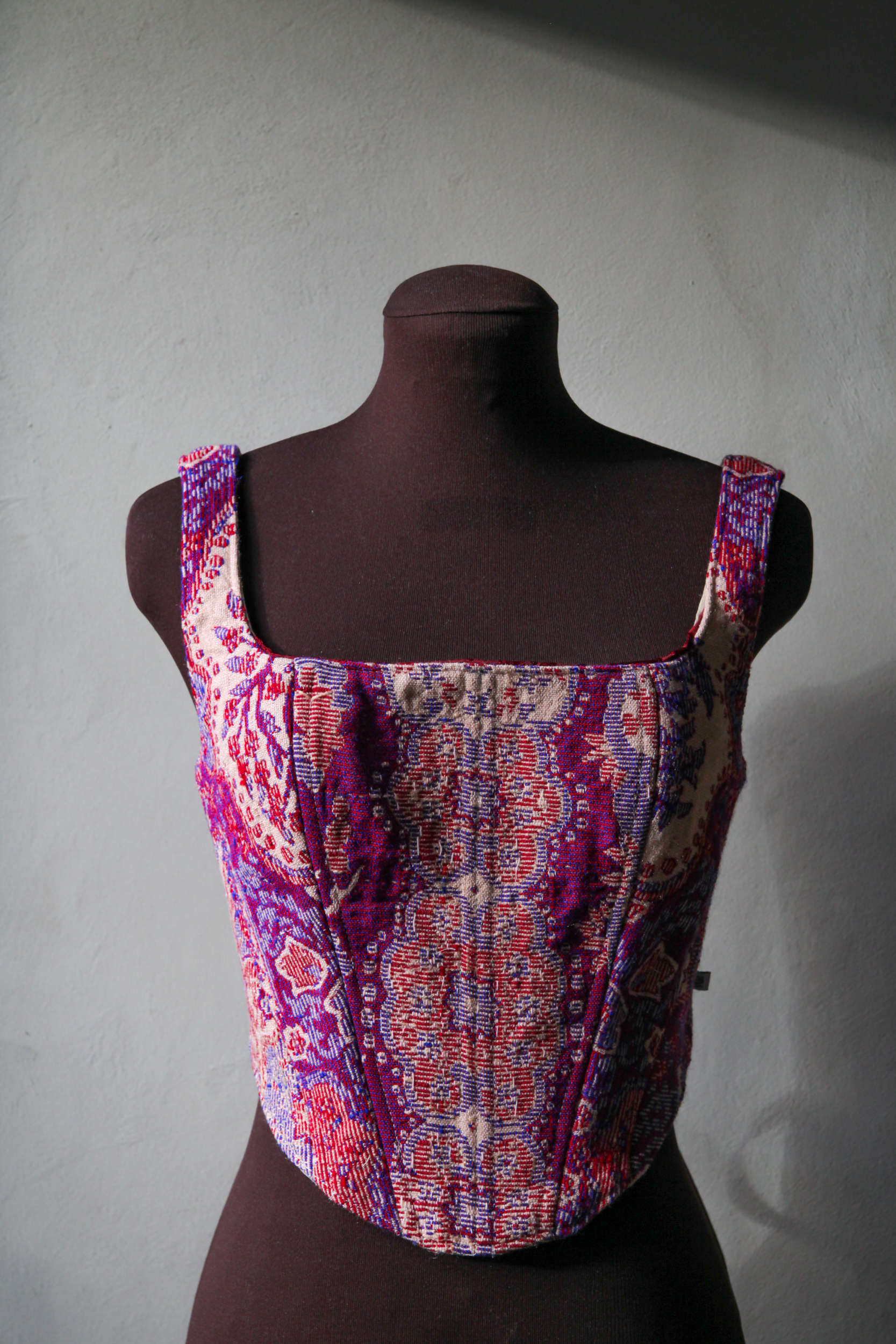 Corset top made of fabric with vintage pink, red and purple print, upcycled