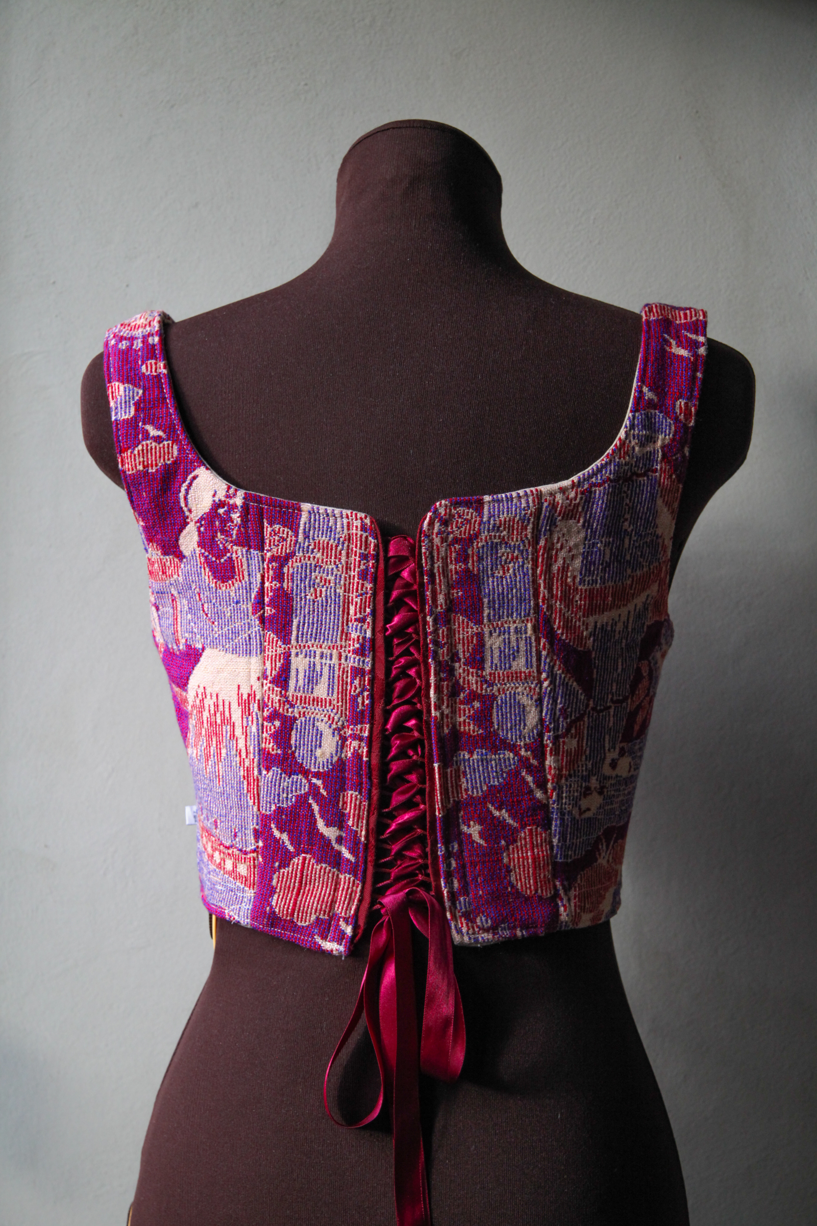 Corset top made of fabric with vintage pink, red and purple print, upcycled