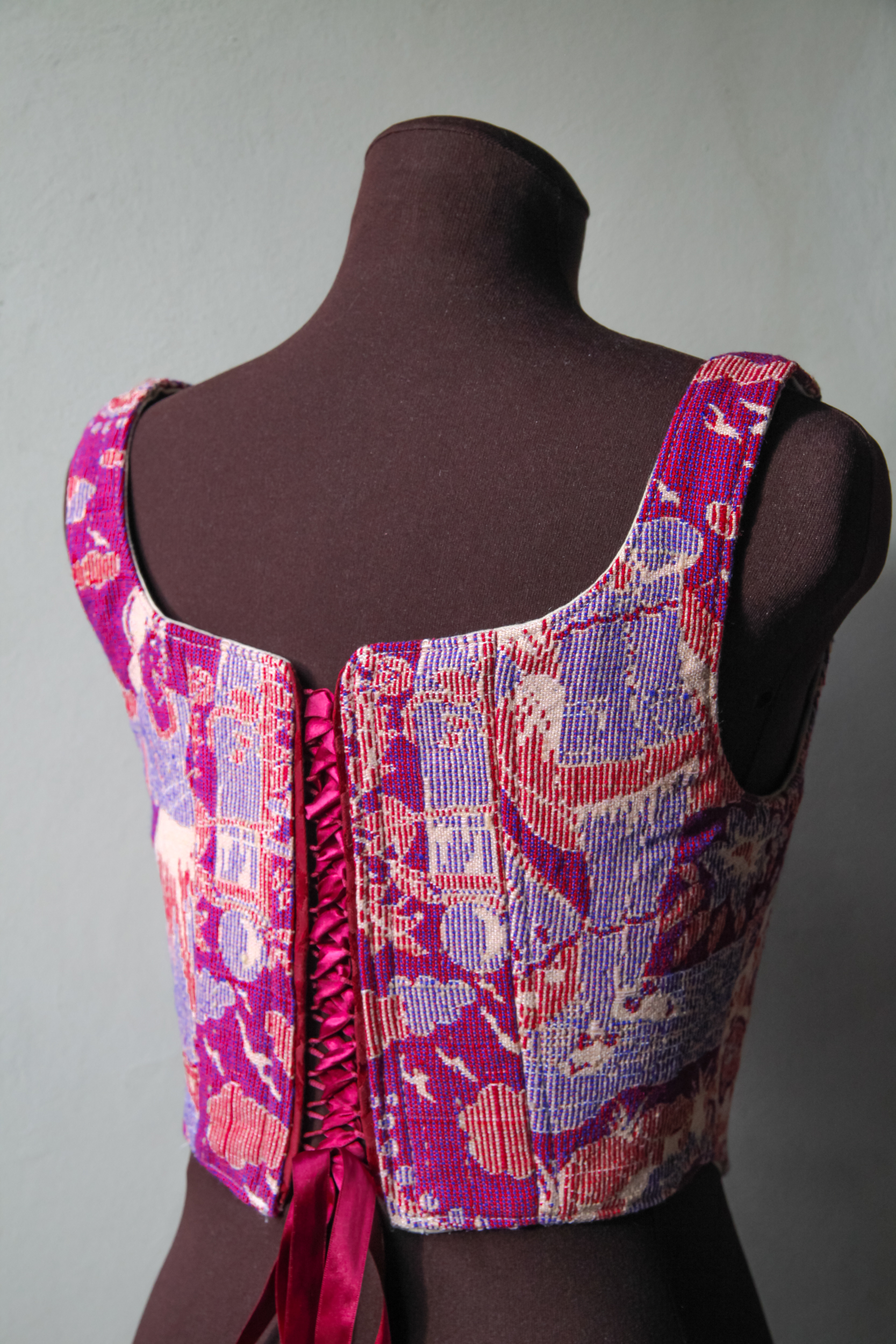 Corset top made of fabric with vintage pink, red and purple print, upcycled