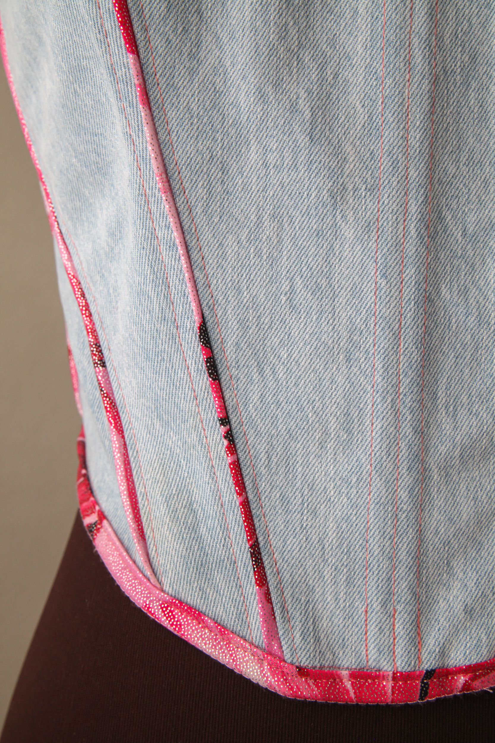 Denim corset top with pink details