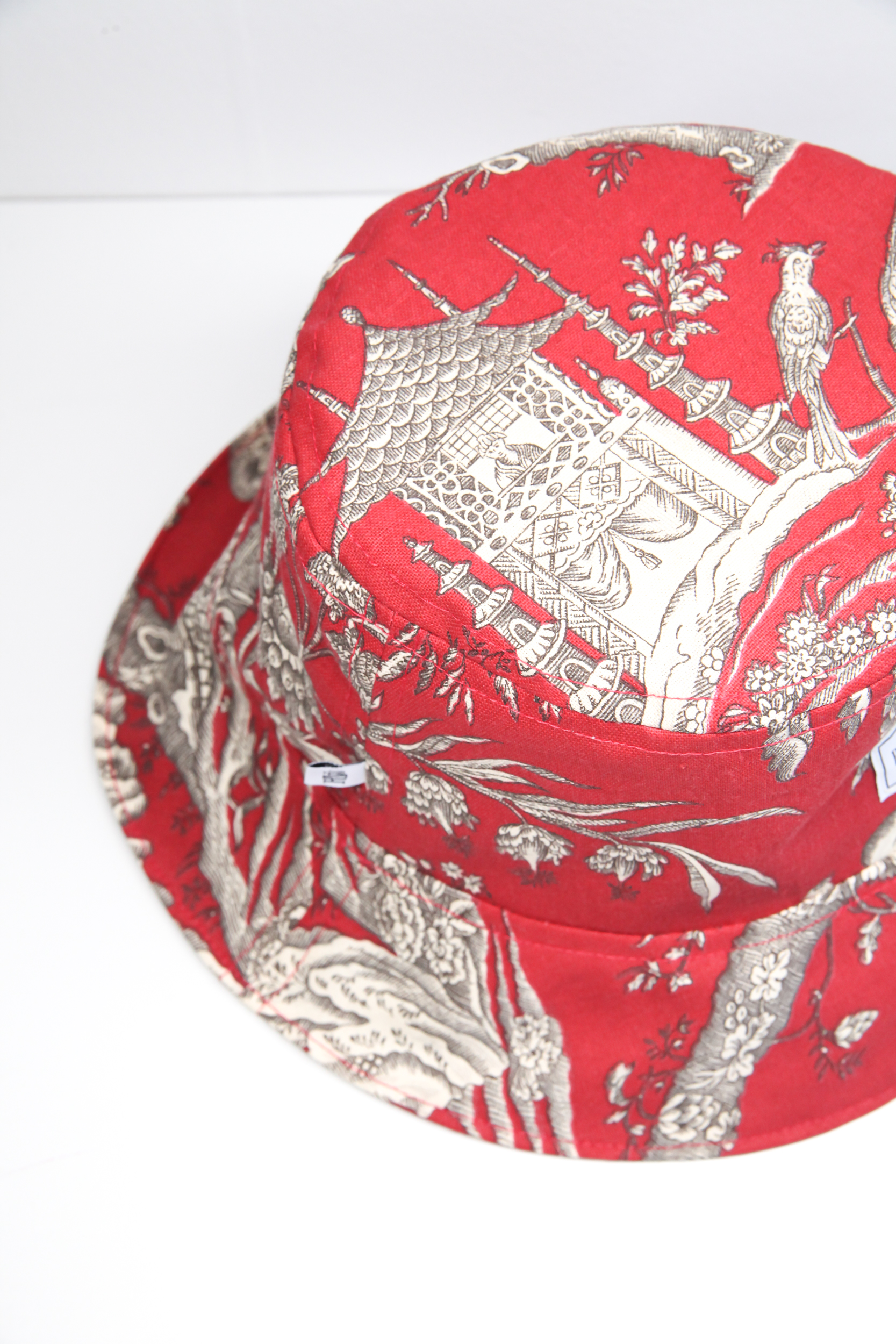 Red burgundy bucket hat with vintage Chinese pattern print