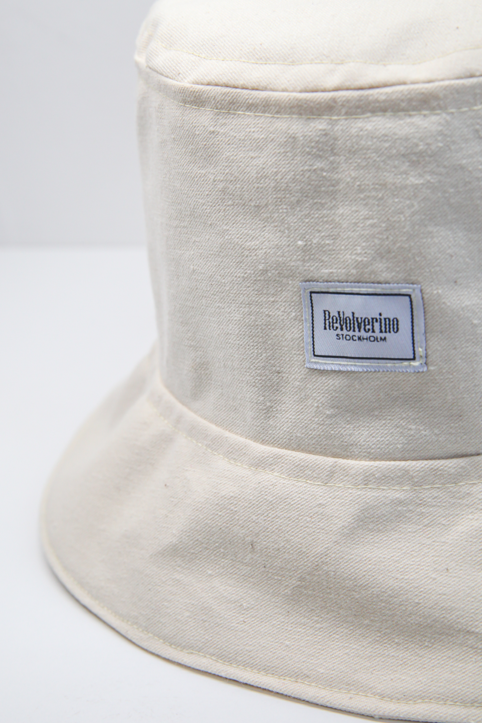 Beige rigid fabric bucket hat raw