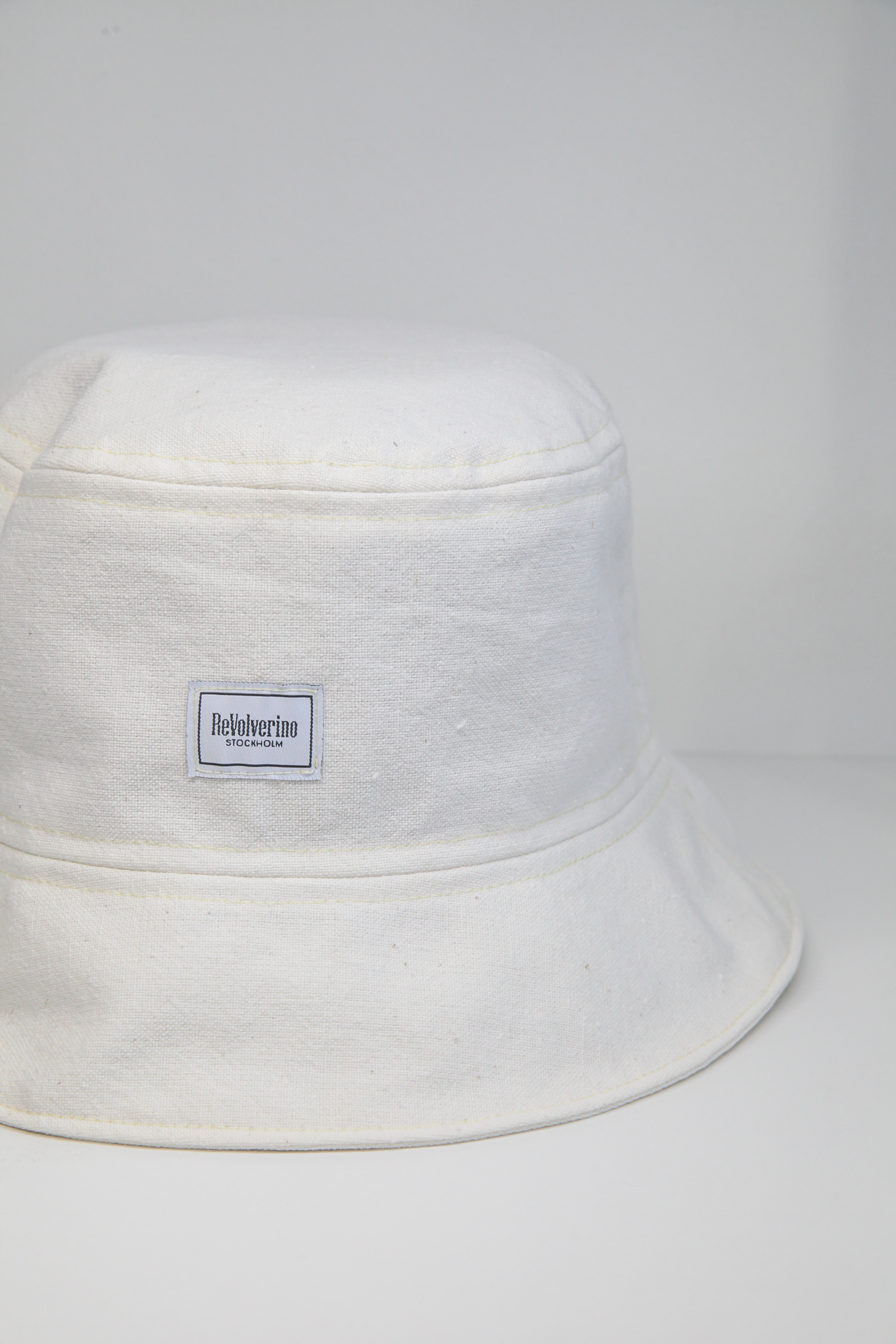 Off white rigid fabric bucket hat raw